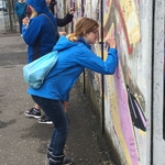 Ellie signing peace wall
